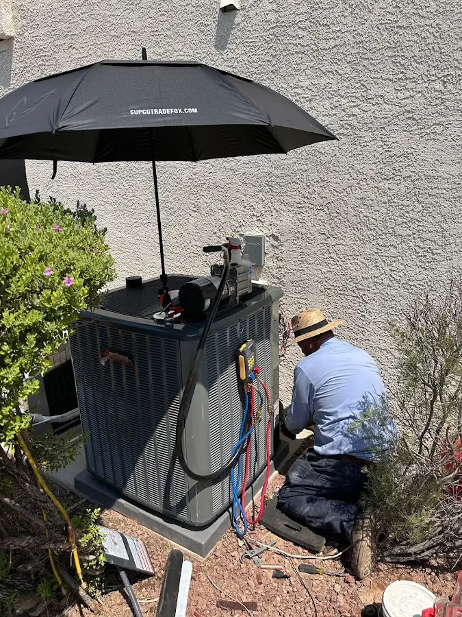 HVAC technician performing outdoor AC maintenance in Walnut Creek